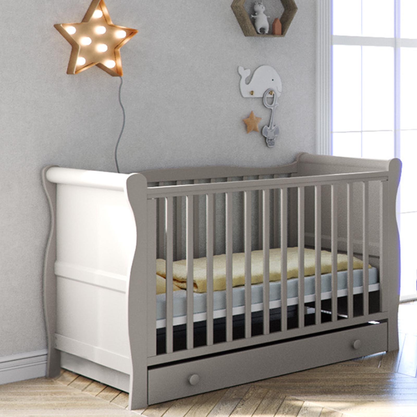 grey cot with mattress