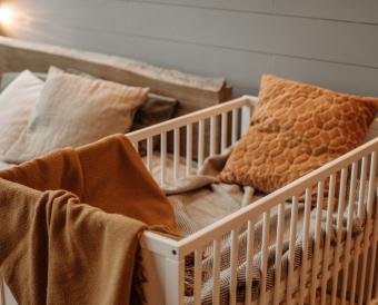 crib next to bed